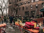 Emergency first responders remain at the scene of an intense fire at a 19-story residential building that erupted in the morning on January 9, 2022 in the Bronx borough of New York City.(AFP)