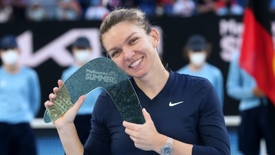 Simona Halep of Romania with the winner's trophy after her singles match against Veronika Kudermetova of Russia during the women's final of the Summer Set 1 tournament ahead of the Australian Open in Melbourne, Australia, Sunday, Jan. 9, 2022 (AP) Simona Halep of Romania with the winner's trophy after her singles match against Veronika Kudermetova of Russia during the women's final of the Summer Set 1 tournament ahead of the Australian Open in Melbourne, Australia, Sunday, Jan. 9, 2022 (AP)