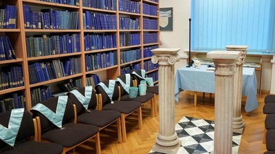 Masonic collars are seen next to book shelves at the Poznan University Library, housing a historic archive of Freemasonry in Europe amassed by the Nazis, in Poznan, western Poland. (AFP) Masonic collars are seen next to book shelves at the Poznan University Library, housing a historic archive of Freemasonry in Europe amassed by the Nazis, in Poznan, western Poland. (AFP)