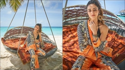 Pulling back her wavy tresses into a high ponytail hairstyle, Ananya flaunted a pair of diamond-shaped brown earrings and further accessorised her Boho look with a golden chain, a set of funky charms bracelets and a stack of finger rings. &nbsp; (Instagram/ananyapanday )