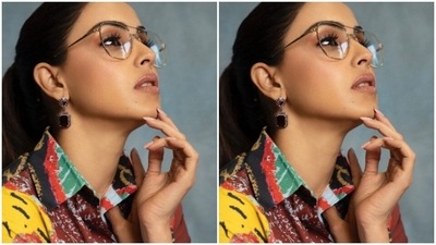 Genelia accessorised her look with black and silver earrings from Abhilasha Pret Jewellery and gold-framed glasses from the house of Rosvin Bugs. "Count your rainbows, not your thunderstorms," she captioned her pictures. (Instagram/@geneliad)