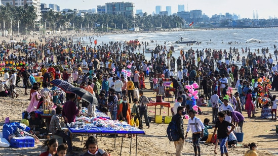 Mumbai: People gather at the Juhu beach amid restrictions imposed due to rising Covid-19 cases in Mumbai, Sunday.(PTI)