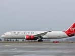 A Virgin Atlantic Airways plane taxis at the Seattle-Tacoma International Airport in Seattle. Virgin Atlantic has received 400 million pounds of new funding from its shareholders to help the airline ride out the coronavirus pandemic. (AP Photo/Ted S. Warren) A Virgin Atlantic Airways plane taxis at the Seattle-Tacoma International Airport in Seattle. Virgin Atlantic has received 400 million pounds of new funding from its shareholders to help the airline ride out the coronavirus pandemic. (AP Photo/Ted S. Warren)
