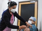 A health worker administering Covid-19 vaccine.(PTI) A health worker administering Covid-19 vaccine.(PTI)
