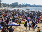 People gather at the Juhu beach amid restrictions imposed due to rising Covid-19 cases in Mumbai on Sunday. (PTI)(HT_PRINT) People gather at the Juhu beach amid restrictions imposed due to rising Covid-19 cases in Mumbai on Sunday. (PTI)(HT_PRINT)