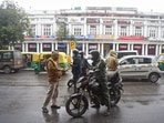 Delhi Police personnel checking vehicles during the weekend curfew to curb the spread of Covid-19 cases, at Connaught Place on Saturday. Delhi Police personnel checking vehicles during the weekend curfew to curb the spread of Covid-19 cases, at Connaught Place on Saturday.