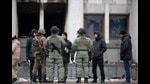 Kazakh soldiers patrol and guard the city hall building after clashes in the central square following violent protests over the price increase of the fuel. (AP) Kazakh soldiers patrol and guard the city hall building after clashes in the central square following violent protests over the price increase of the fuel. (AP)
