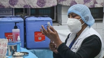 A health worker takes part in a dry run or a mock drill for Covid-19 coronavirus vaccine delivery at a model Covid-19 vaccination centre, New Delhi, January 2, 2021 (Sanchit Khanna/HT PHOTO) A health worker takes part in a dry run or a mock drill for Covid-19 coronavirus vaccine delivery at a model Covid-19 vaccination centre, New Delhi, January 2, 2021 (Sanchit Khanna/HT PHOTO)