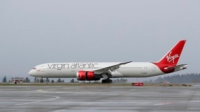 A Virgin Atlantic Airways plane taxis at the Seattle-Tacoma International Airport in Seattle. Virgin Atlantic has received 400 million pounds of new funding from its shareholders to help the airline ride out the coronavirus pandemic.&nbsp; (AP Photo/Ted S. Warren)