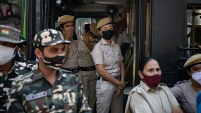 Policewomen standing guard outside police headquarters in New Delhi. (AP)