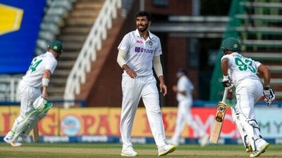 India's bowler Jasprit Bumrah, center, reacts as South Africa's batsman Keegan Petersen, right, and captain Dean Elgar, run between the wickets during the first day of the 2nd Test Cricket match between South Africa and India at the Wanderers stadium in Johannesburg, South Africa, Monday, Jan. 3, 2022. (AP)