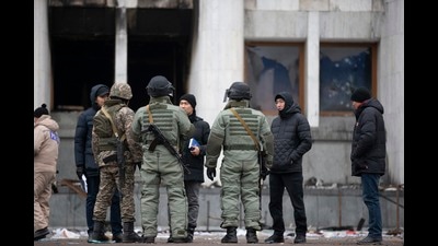 Kazakh soldiers patrol and guard the city hall building after clashes in the central square following violent protests over the price increase of the fuel. (AP) Kazakh soldiers patrol and guard the city hall building after clashes in the central square following violent protests over the price increase of the fuel. (AP)