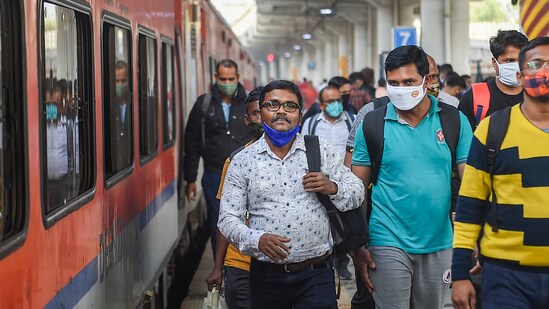 Passengers wearing face masks as a precaution against Covid-19 arrive at Dadar railway station in Mumbai.&nbsp;(PTI file photo)