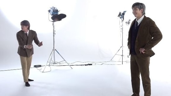 BTS' Jin throwing a shoe in front of RM during his photoshoot.