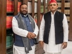 Samajwadi Party chief Akhilesh Yadav with former UP minister Swami Prasad Maurya. (Twitter@yadavakhilesh)