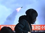 People walk past a television screen showing a news broadcast with file footage of a North Korean missile test, at a railway station in Seoul on January 11, 2022, after North Korea fired a "suspected ballistic missile" into the sea, People walk past a television screen showing a news broadcast with file footage of a North Korean missile test, at a railway station in Seoul on January 11, 2022, after North Korea fired a "suspected ballistic missile" into the sea, 