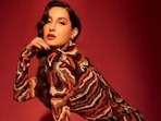 Nora Fatehi teams firecracker look in hourglass-flaunting tiger print mini dress with <span class='webrupee'>₹</span>50k shoes: All pics Nora Fatehi teams firecracker look in hourglass-flaunting tiger print mini dress with <span class='webrupee'>₹</span>50k shoes: All pics