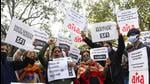 AISA and other organisations’ supporters hold placards as they stage a protest against the hate speech in Haridwar outside Uttrakhand Bhawan, in New Delhi. (ANI) AISA and other organisations’ supporters hold placards as they stage a protest against the hate speech in Haridwar outside Uttrakhand Bhawan, in New Delhi. (ANI)