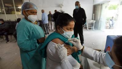 Noida, India - January 11, 2022: A health worker being inoculated with a booster dose of Covid-19 vaccine at the district hospital in Sector 30, Noida, India, on Tuesday, January 11, 2022. (Photo by Sunil Ghosh / Hindustan Times) Noida, India - January 11, 2022: A health worker being inoculated with a booster dose of Covid-19 vaccine at the district hospital in Sector 30, Noida, India, on Tuesday, January 11, 2022. (Photo by Sunil Ghosh / Hindustan Times)