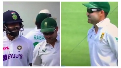 Virat Kohli has a chat with Dean Elgar after surviving DRS scare