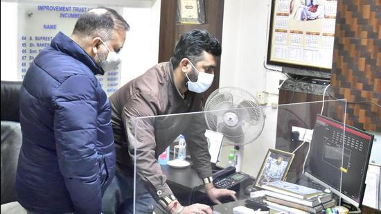 A flying squad during raids at Ludhiana Improvement Trust office in Ludhiana on Tuesday after allegations of poll code violations. (Gurpreet Singh/HT)