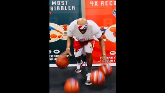 Corey Rich as he bounced four basketballs 326 times within 30 seconds.&nbsp;(instagram/@guinnessworldrecords)