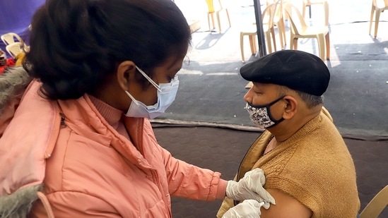 A beneficiary receives a 'precautionary dose' of Covid-19 vaccine in New Delhi on Monday. (ANI Photo)