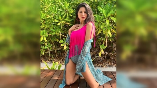 Sunny Leone also made headlines for her pictures in a blue and pink printed one-shoulder swimsuit which she teamed with a matching cape.(Instagram/@sunnyleone)