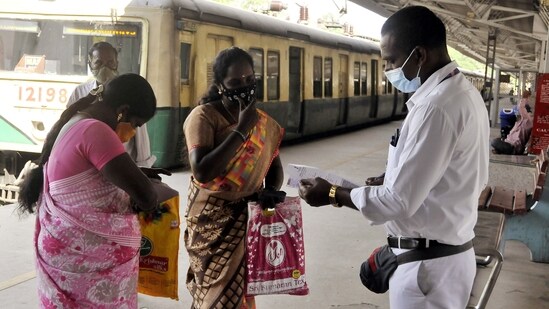 A railway staff checks the Covid-19 vaccination certificates of a passenger before allowing them to board the train in view of Omicron-driven Coronavirus surge, at a railway station in Chennai on Monday.(ANI Photo)