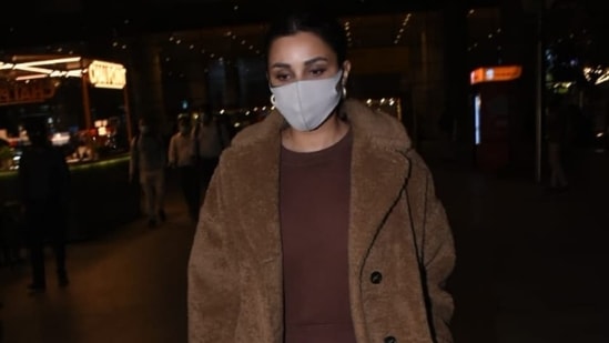 Actor Parineeti Chopra arrived in Mumbai last night, and shutterbugs clicked her getting out of the airport. The star slayed airport fashion in a comfy athleisure fit. She gave us tips on keeping the airport look chic and winter-ready with her choice of ensemble, and we are taking notes.(HT Photo/Varinder Chawla)