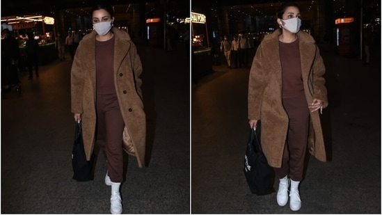 The 33-year-old actor teamed the jumper with a pair of high waisted joggers that came in the same brown shade. The pants featured a skinny fit, and Parineeti teamed them with ribbed white socks. She added a street-style touch by tucking the hem of her pants inside the socks.(HT Photo/Varinder Chawla)