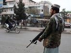 A Taliban fighter stands guard in Kabul, Afghanistan.&nbsp;