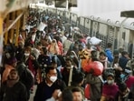 Passengers not adhering to social distancing norms board a train at a railway station, amid the spread of the Omicron variant of Covid-19 in Patna.&nbsp;