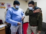 A Delhi police person after being administered a booster dose of COVID-19 vaccine at RML hospital in New Delhi. A Delhi police person after being administered a booster dose of COVID-19 vaccine at RML hospital in New Delhi.