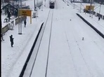 The image, taken from the video, shows the snow-covered railway station.