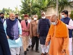 Union home minister Amit Shah, Uttar Pradesh chief minister Yogi Adityanath and other BJP leaders arrive for the party's core committee meeting, in New Delhi on Tuesday.
