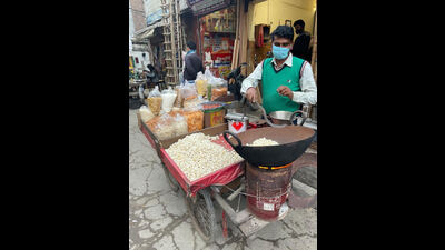 Local vendors selling gajjak, rewari and popcorn claim that their sales have been low this year. Local vendors selling gajjak, rewari and popcorn claim that their sales have been low this year.