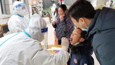 A child undergoes a nucleic acid test for Covid-19 in Anyang in China’s central Henan province on Wednesday. (AFP) A child undergoes a nucleic acid test for Covid-19 in Anyang in China’s central Henan province on Wednesday. (AFP)