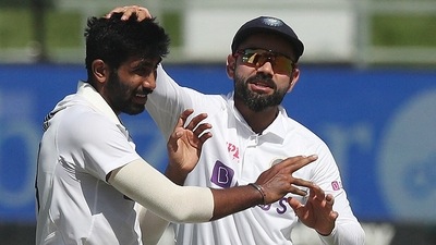 Jasprit Bumrah celebrates with Virat Kohli after taking the wicket of Keegan Petersen (REUTERS)