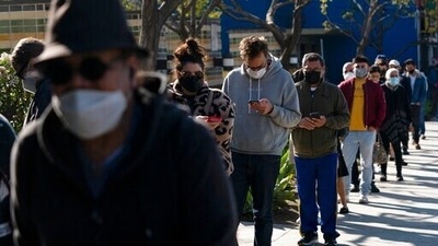 People wait in line for a Covid-19 test in Los Angeles. (AP) People wait in line for a Covid-19 test in Los Angeles. (AP)