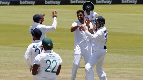 India's Ravichandran Ashwin celebrates after taking the wicket of South Africa's Lungi Ngidi with teammates to win the match.(REUTERS)