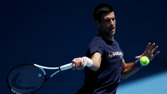 Serbian tennis player Novak Djokovic practices at Melbourne Park as questions remain over the legal battle regarding his visa to play in the Australian Open in Melbourne, Australia.(REUTERS)