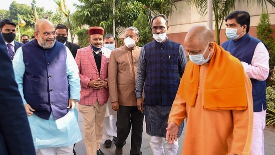 Union home minister Amit Shah, Uttar Pradesh chief minister Yogi Adityanath and other BJP leaders arrive for the party's core committee meeting, in New Delhi on Tuesday.(PTI Photo)