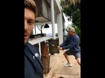 The image, taken from the video shared on Instagram, shows Chris Hemsworth trying to chop a piece of wood log.(Instagram/@chrishemsworth)