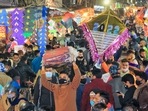 People crowd as they purchase kites ahead of the Makar Sankranti Festival at Haldiyon Ka Rasta in Jaipur.