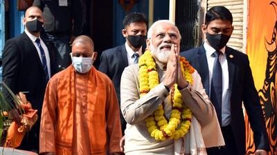 Prime Minister Narendra Modi with UP chief minister Yogi Adityanath greets the supporters as he arrives at Kaal Bhairav Temple before the inauguration of Kashi Vishwanath Dham Corridor, in Varanasi, ahead of the elections, on December 13. (ANI) Prime Minister Narendra Modi with UP chief minister Yogi Adityanath greets the supporters as he arrives at Kaal Bhairav Temple before the inauguration of Kashi Vishwanath Dham Corridor, in Varanasi, ahead of the elections, on December 13. (ANI)