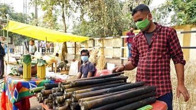 A street vendor can be seen selling Sunga Pitha (bamboo rice cake), a traditional delicacy ahead of Magh Bihu in Guwahati. (ANI) A street vendor can be seen selling Sunga Pitha (bamboo rice cake), a traditional delicacy ahead of Magh Bihu in Guwahati. (ANI)