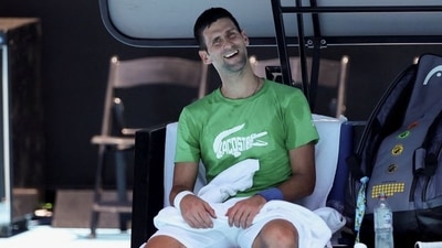 Serbian tennis player Novak Djokovic takes a break as he practices at Melbourne Park as questions remain over the legal battle regarding his visa to play in the Australian Open in Melbourne, Australia, January 13, 2022. (REUTERS)