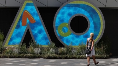 A person walks through Melbourne Park in the lead-up to the Australian Open in Melbourne, Australia, January 12, 2022 (REUTERS)