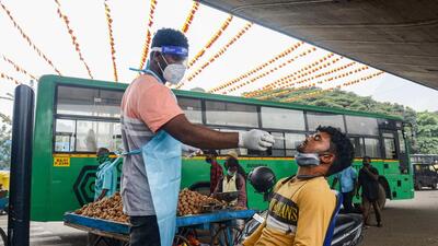 Karnataka, which has been witnessing a steady surge in cases since the last week of December, recorded 21,390 fresh infections on Wednesday. (PTI)